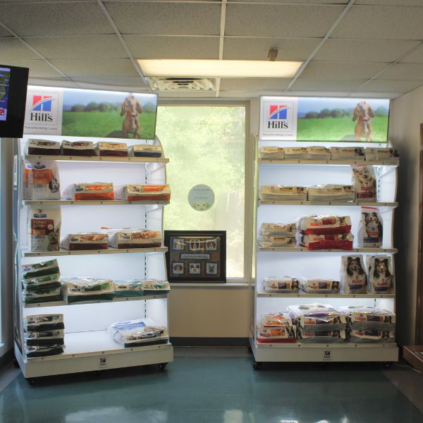 shelves showcasing various brands of dog food