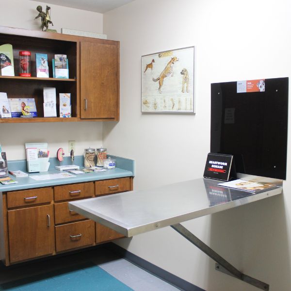 A small office featuring a desk and cabinets